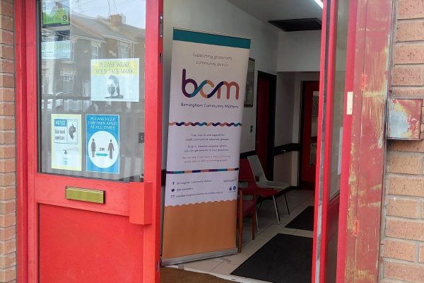 Red double doors: entrance to Soho Community Hall